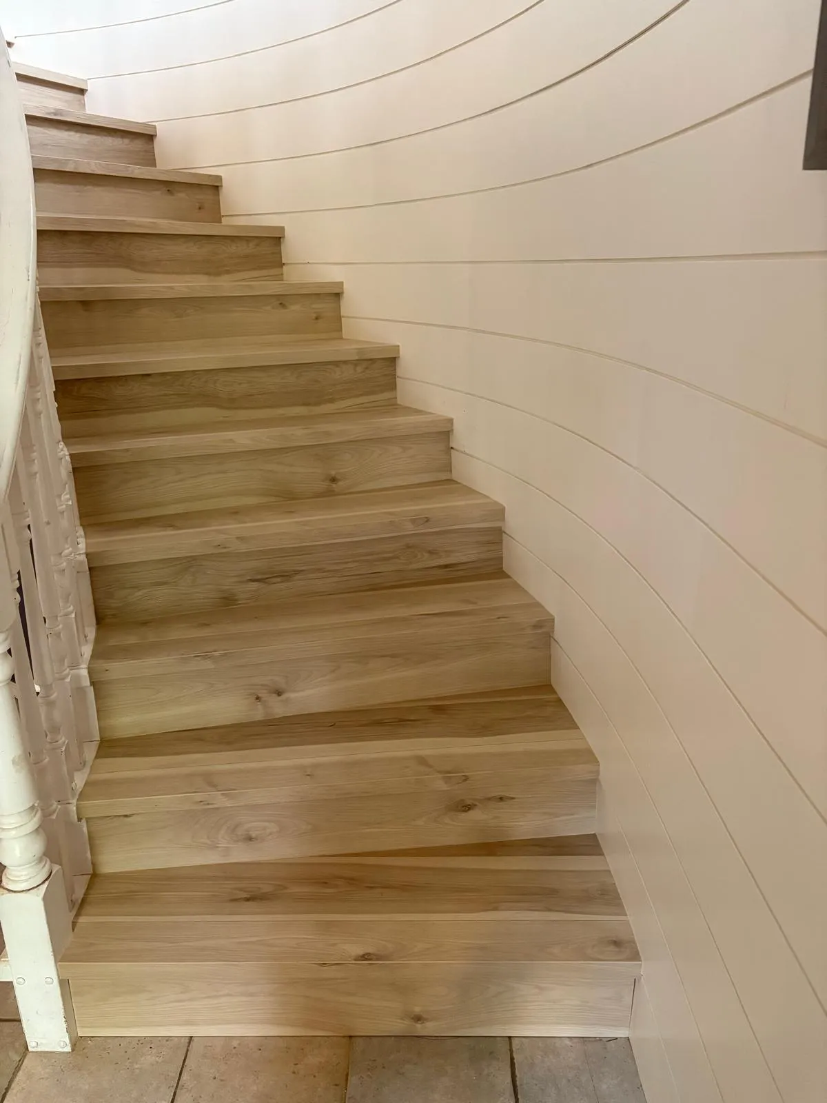 before/after photo of a completed staircase install
