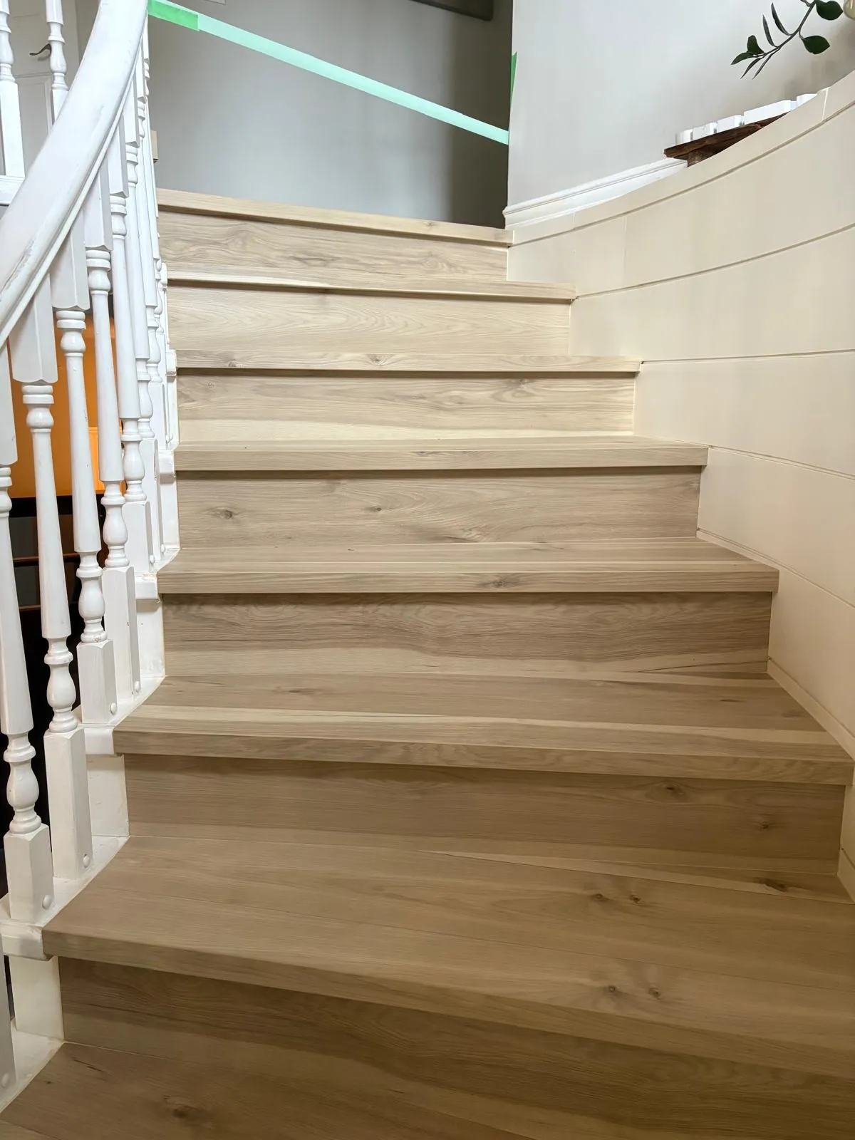 Hardwood flooring - stairs (after) - Natural-oak curved staircase w/ beadboard